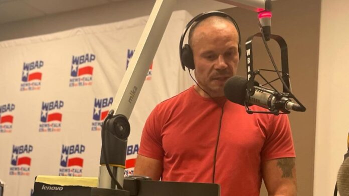 Dan Bongino recording in his studio.