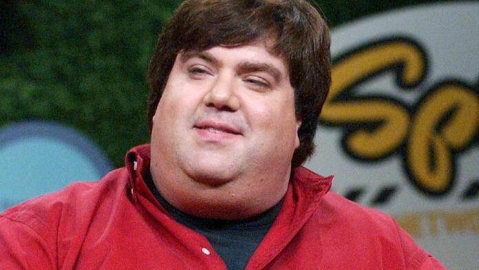 Dan Schneider with a red shirt