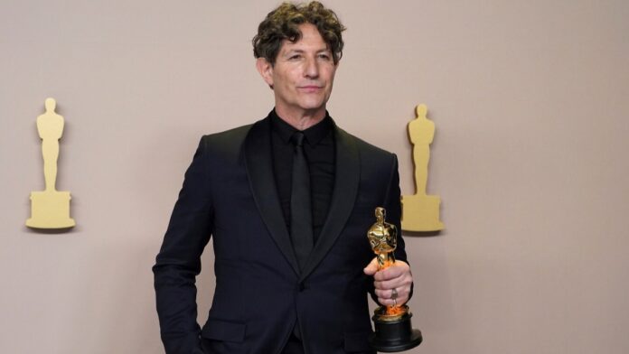 Jonathan Glazer holding an award